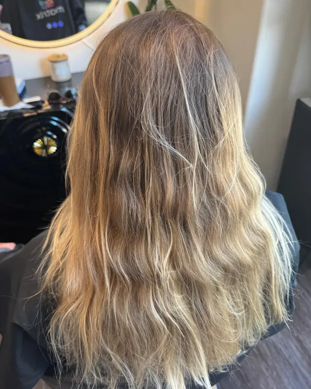 Before: grown-out, brassy blonde with uneven, wavy ends