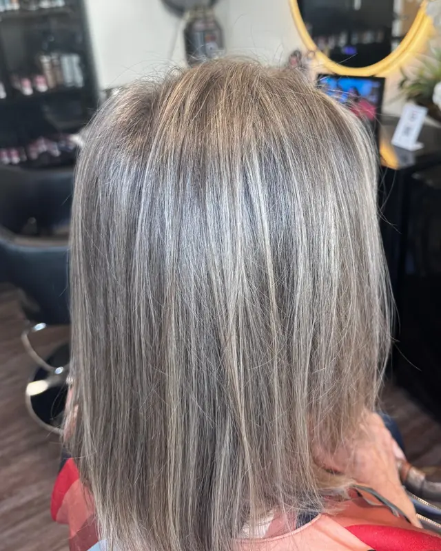 After: gray blended into soft silver highlights, with a fresh blunt bob