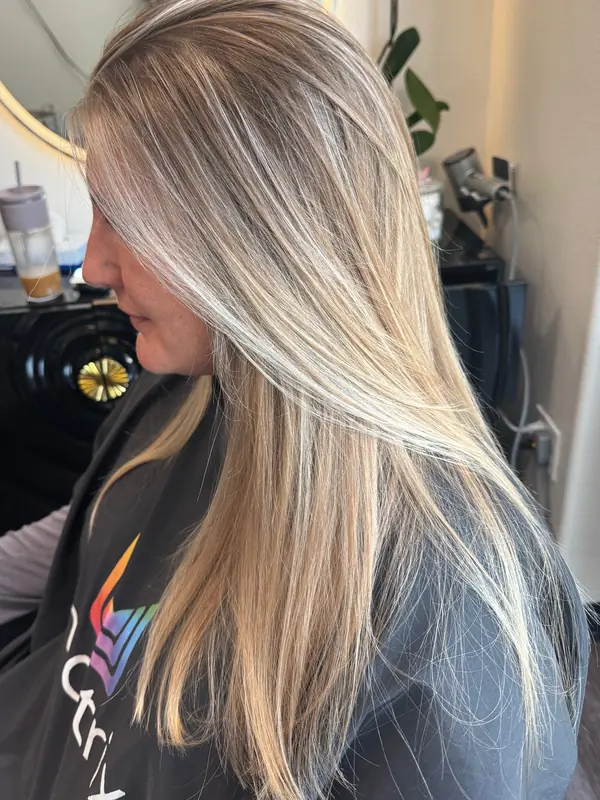 Long, bright blonde highlights with soft, face-framing pieces